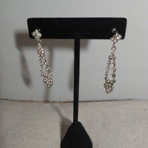 Silver tone rhinestone drop earrings.